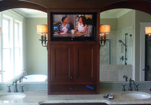 Wired Installations installed TV and cable in custom built-in bookcase within bathroom<br>
Brands: Samsung, Sanus